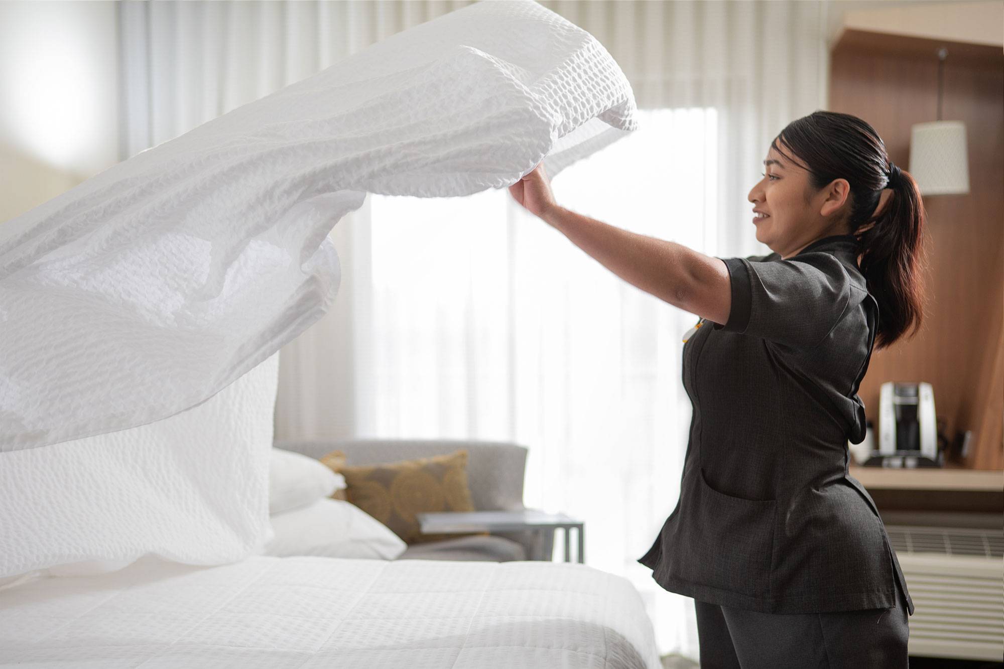Team Member Changing Sheets